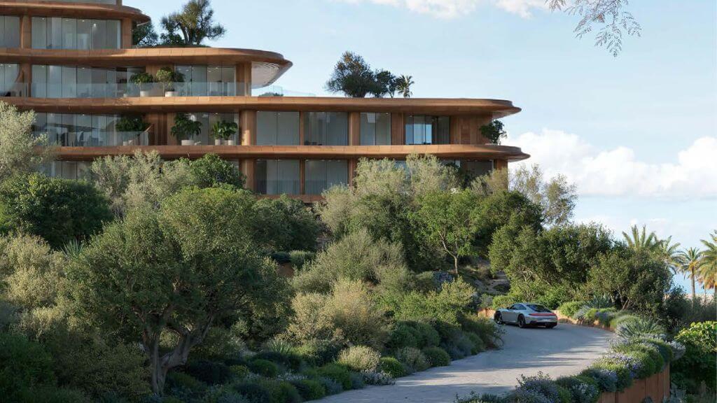 Jumeirah Asora Bay Villa Exterior | Private Residence at La Mer South Exterior view of a private villa at Jumeirah Asora Bay, surrounded by lush greenery and natural landscaping with a curved entry driveway.
